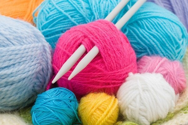 Colorful yarn and knitting needles.