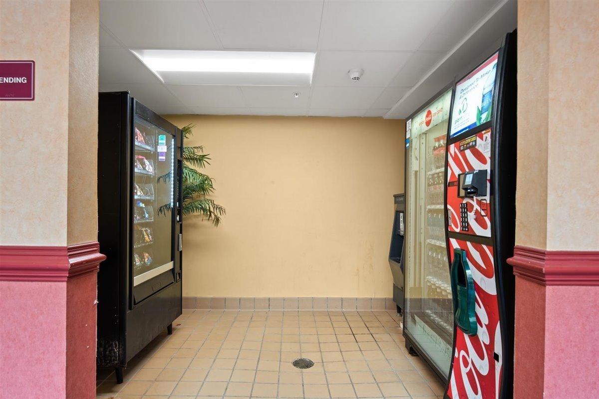 a hallway with a vending machine in it
